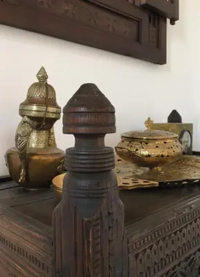 a wooden table with two vases on top of it at Susanna Apartments - Your Oasis in Athens Ano Petralona in Athens