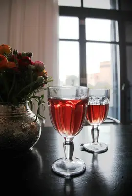two glasses of red wine sitting on a table at Susanna Apartments - Your Oasis in Athens Ano Petralona in Athens