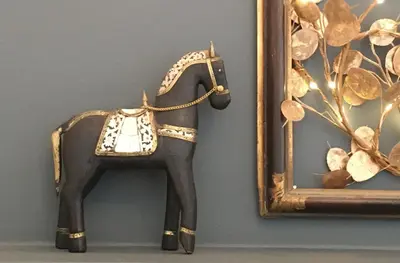 a figurine of a horse next to a mirror at Susanna Apartments - Your Oasis in Athens Ano Petralona in Athens