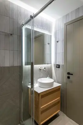 a bathroom with a sink and a glass shower at PAREA Athens in Athens