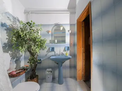 a bathroom with a sink and a mirror at Marin Holiday in Dhaskalión