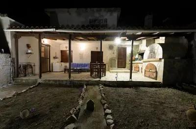 an outside view of a house at night at Marin Holiday in Dhaskalión