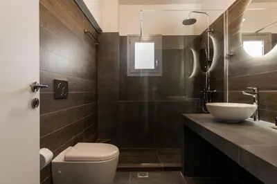 a bathroom with a sink and a toilet at Stellar 3BR Apartment with Balcony by UPSTREET in Athens