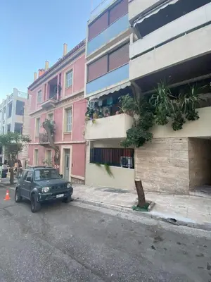 a black truck parked in front of a building at Boho Chic Apartment Under Acropolis in Athens