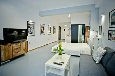 a large living room with a bed and a couch at The old Tailor Factory White Room in Athens