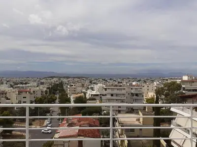 a view of a city from a balcony at Cozy Bright Studio in Athens