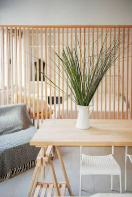 a living room with a table and a vase with a plant at Stylish living by Acropolis (Monastiraki 5) in Athens