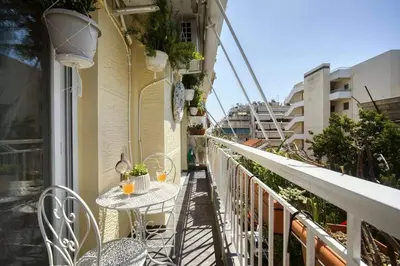a balcony with a table and chairs on a balcony at Luxury Apartment Marina Zeas Piraeus - Balcony - Near Port in Piraeus