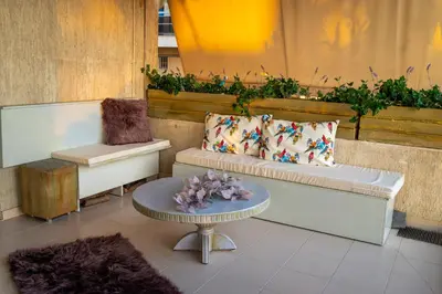 a seating area with a couch and a table at Alimos - Sea View Apartment in Athens