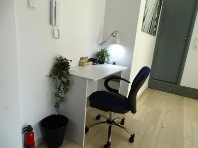 an office with a desk and a chair at Zeus Bright & New Apartment - 25' walk to the Acropolis in Athens