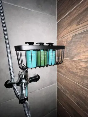 a light on a wall in a bathroom at Zeus Bright & New Apartment - 25' walk to the Acropolis in Athens