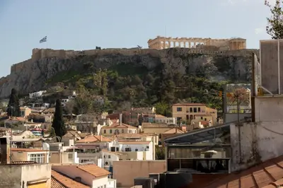 a view of a city with a mountain in the background at Athens Hills in Athens