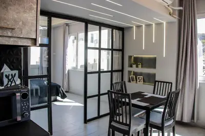 a dining room with a table and chairs at Athens Hills in Athens
