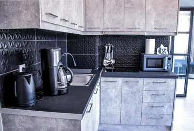 a kitchen with a sink and a microwave at Athens Hills in Athens