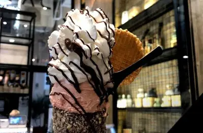 a chocolate ice cream cone with whipped cream at Monastiraki 510 SuperHost Hub in Athens