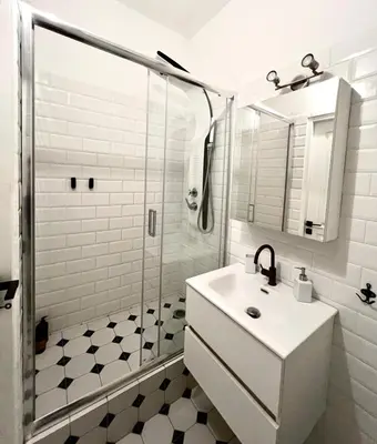 a white bathroom with a sink and a shower at Monastiraki 510 SuperHost Hub in Athens