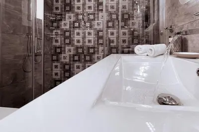 a white bathroom with a tub and a shower at Penthouse - Amazing View in the Center of Athens in Athens