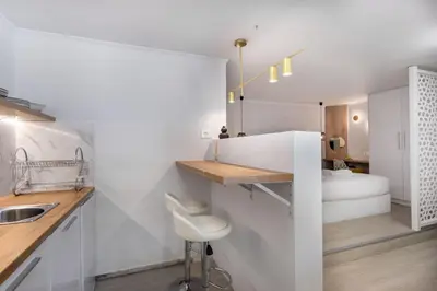 a white bathroom with a sink and a toilet at Seaside Nestie by BluPine in Athens