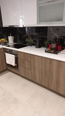 a kitchen with wooden cabinets and a white counter top at Arman Group Lannister in Athens