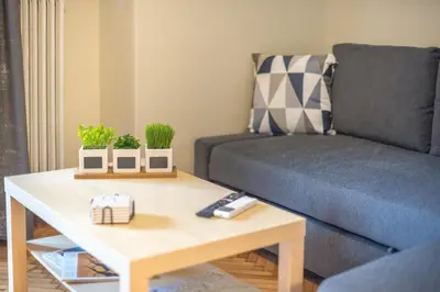 a living room with a couch and a coffee table at Supreme Suite with balcony by Cloudkeys in Athens