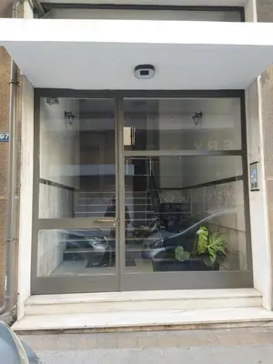 a glass window with a plant in the middle at Supreme Suite with balcony by Cloudkeys in Athens