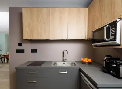 a kitchen with a sink and a microwave at Crossroads Athens by YHA in Athens