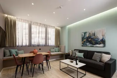 a living room with a couch and a table at Crossroads Athens by YHA in Athens