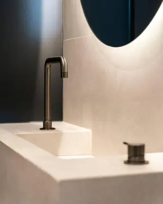 a bathroom sink with a faucet and a mirror at 5BD Luxury Penthouse with Sea View in Athens