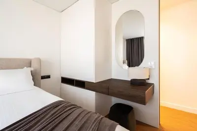 a bedroom with a bed and a mirror at 5BD Luxury Penthouse with Sea View in Athens