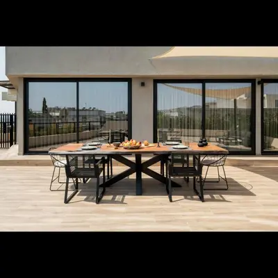 a table and chairs sitting on top of a patio at 5BD Luxury Penthouse with Sea View in Athens