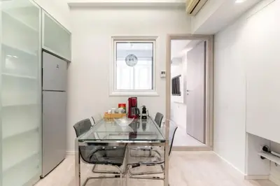 a dining room with a glass table and chairs at Monastiraki 107 SuperHost Hub in Athens