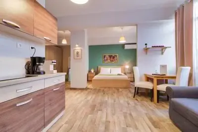 a kitchen and living room with a bed in a room at Monastiraki 212 - 43m2 SuperHost Hub in Athens