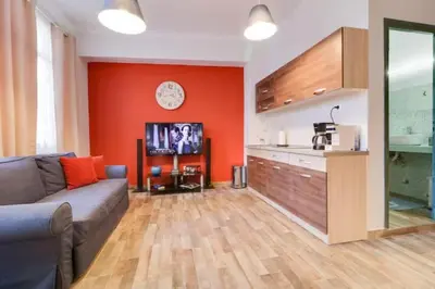 a living room with a couch and a kitchen at Monastiraki 212 - 43m2 SuperHost Hub in Athens