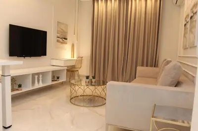 a living room with a tv and a couch at Adri & Marg luxury living in Athens