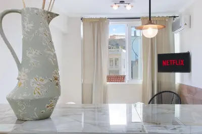 a vase sitting on top of a glass table at Monastiraki 507 SuperHost Hub in Athens