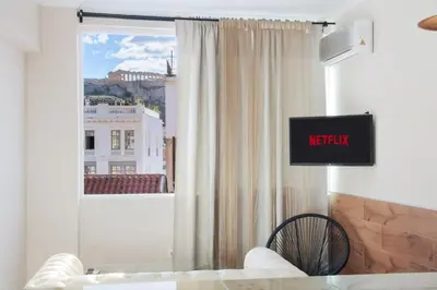 a living room with a view of a window at Monastiraki 507 SuperHost Hub in Athens