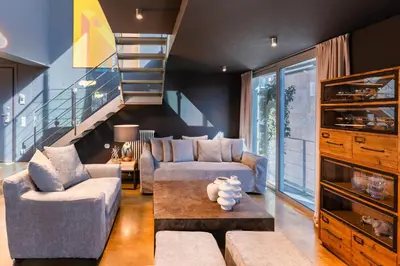 a living room with two couches and a staircase at Ma Maison No5, Private Heated Pool, Acropolis view in Athens