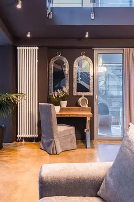 a living room with a couch and a table and mirrors at Ma Maison No5, Private Heated Pool, Acropolis view in Athens
