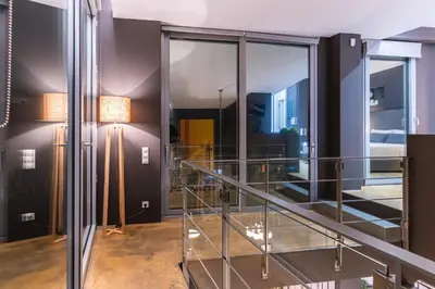 a glass staircase in a building with glass walls at Ma Maison No5, Private Heated Pool, Acropolis view in Athens