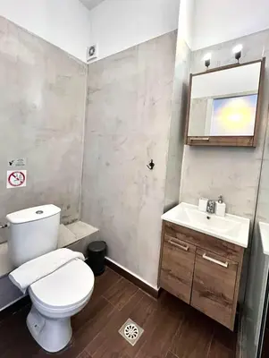 a bathroom with a toilet and a sink at Monastiraki 508 Central Suite in Athens