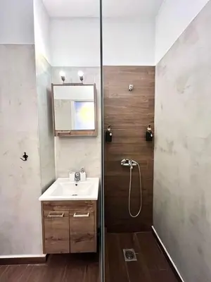 a bathroom with a sink and a shower at Monastiraki 508 Central Suite in Athens
