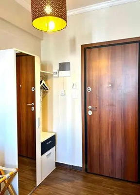 a room with a closet and a wooden door at Monastiraki 508 Central Suite in Athens