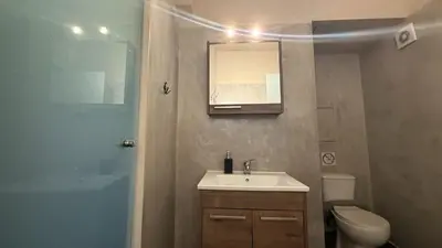 a bathroom with a sink and a toilet and a mirror at Monastiraki 509 Central Suite in Athens