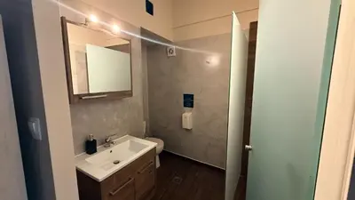 a bathroom with a sink and a mirror at Monastiraki 509 Central Suite in Athens