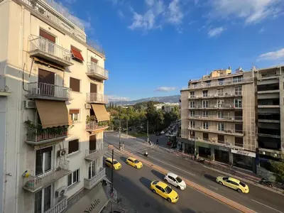 a view of a city street with cars and buildings at A Stroll to the Acropolis - By Athenian Homes in Athens