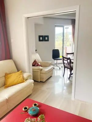 a living room with a couch and a table at A Stroll to the Acropolis - By Athenian Homes in Athens