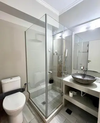 a bathroom with a sink and a toilet and a shower at Monastiraki 312 SuperHost Hub in Athens
