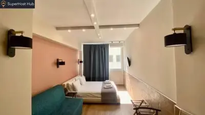 a hotel room with a bed and a window at Monastiraki 306 SuperHost Hub in Athens