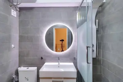 a bathroom with a sink and a mirror at Monastiraki 306 SuperHost Hub in Athens
