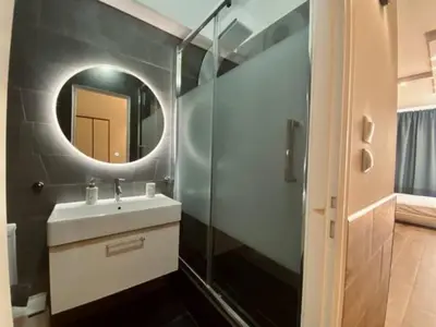 a bathroom with a sink and a mirror at Monastiraki 306 SuperHost Hub in Athens